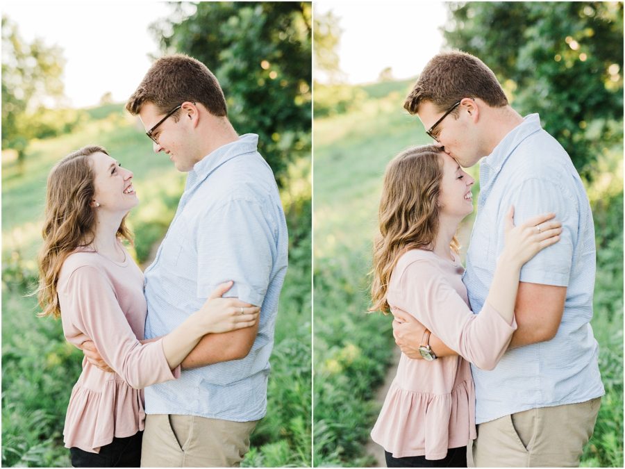 Barn Bluff Engagement Session in Red Wing, MN with man kissing forehead