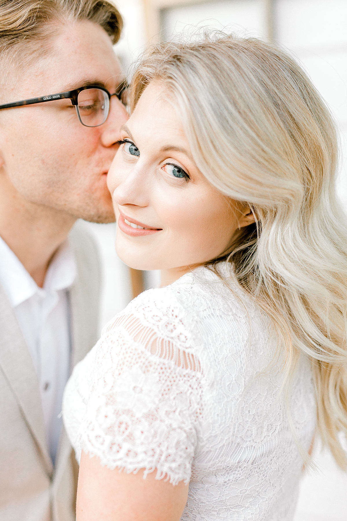 woman in white lace shirt for engagement session pictures